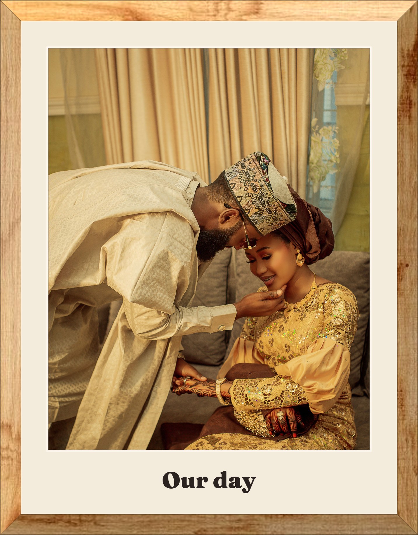 A couple in traditional gold aso-oke in a custom oak frame